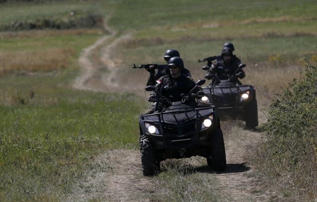 Serbian patrols are seen near Vrska Cuka on Monday (Tanjug/AP)