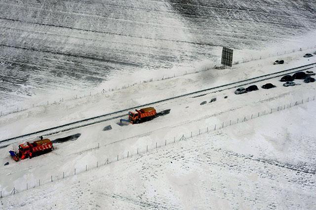 Snowdrifts in south; pileup halts traffic on highway