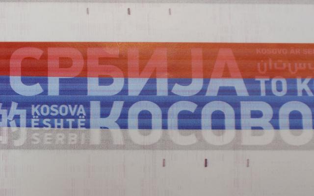 The colors of the Serbian flag with the inscription 'Kosovo is Serbia' are attached to the train's exterior (Tanjug)