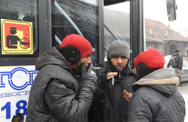 Migrants who accepted to be accommodated in a reception center wait to board a bus in Belgrade on Tuesday (Tanjug)