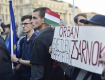 The message 'Orban is a cruel, inhuman tyrant' is displayed during protests against 'anti-Soros law' (Tanjug/AP, file)