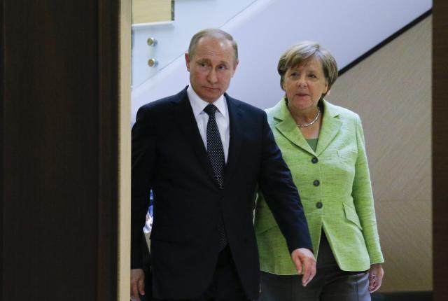Merkel firm, Putin's conciliatory tone; 