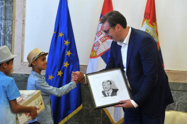 Vucic's "symbolic act may change policy on asylum seekers"