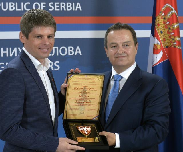 Gouillon (L) is seen with Serbian FM Dacic (Tanjug)