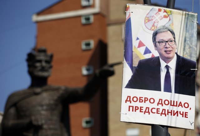 A poster showing Vucic and reading &Welcome, president& is seen in Kosovska Mitrovica in front of the monument to Serbia's Tsar Lazar (Tanjug/AP)