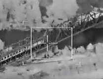 A NATO warplane targetting a train on a bridge in Serbia during the 1999 attack (screenshot, file)