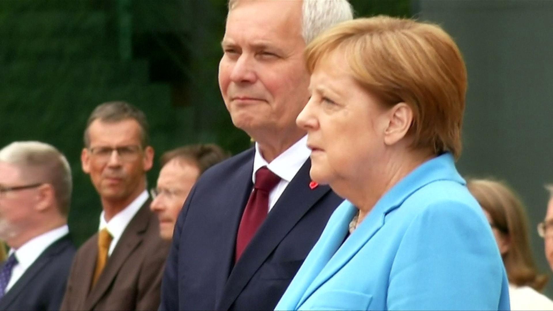Angela Merkel seen shaking for a third time