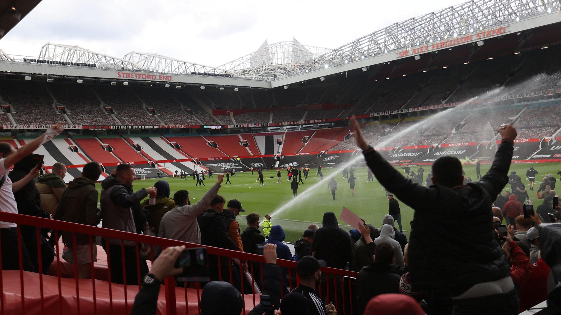Manchester United fans protest on Old Trafford football pitch