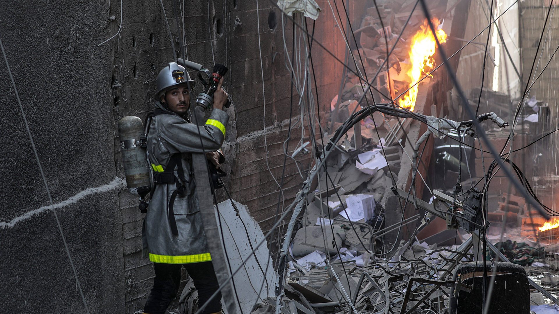 Emergency services arrive at strike hit Gaza flats