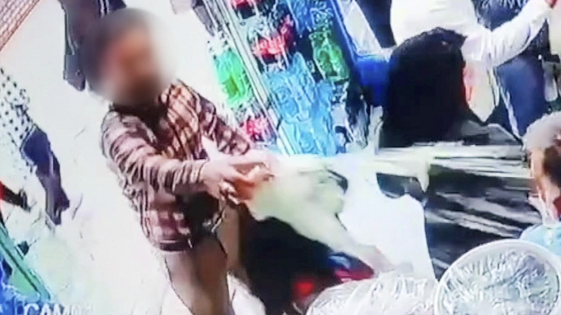 Man pours yoghurt over unveiled woman in Iran shop